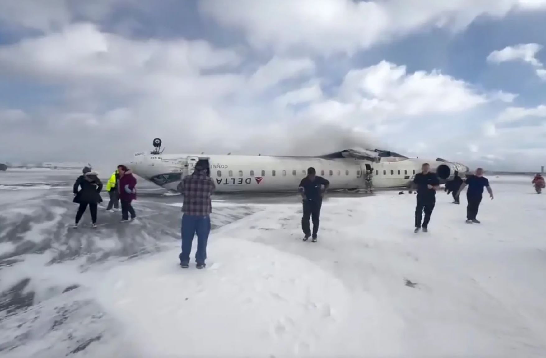 Delta Airlines plane flips on landing in Toronto and a badly hurt child
