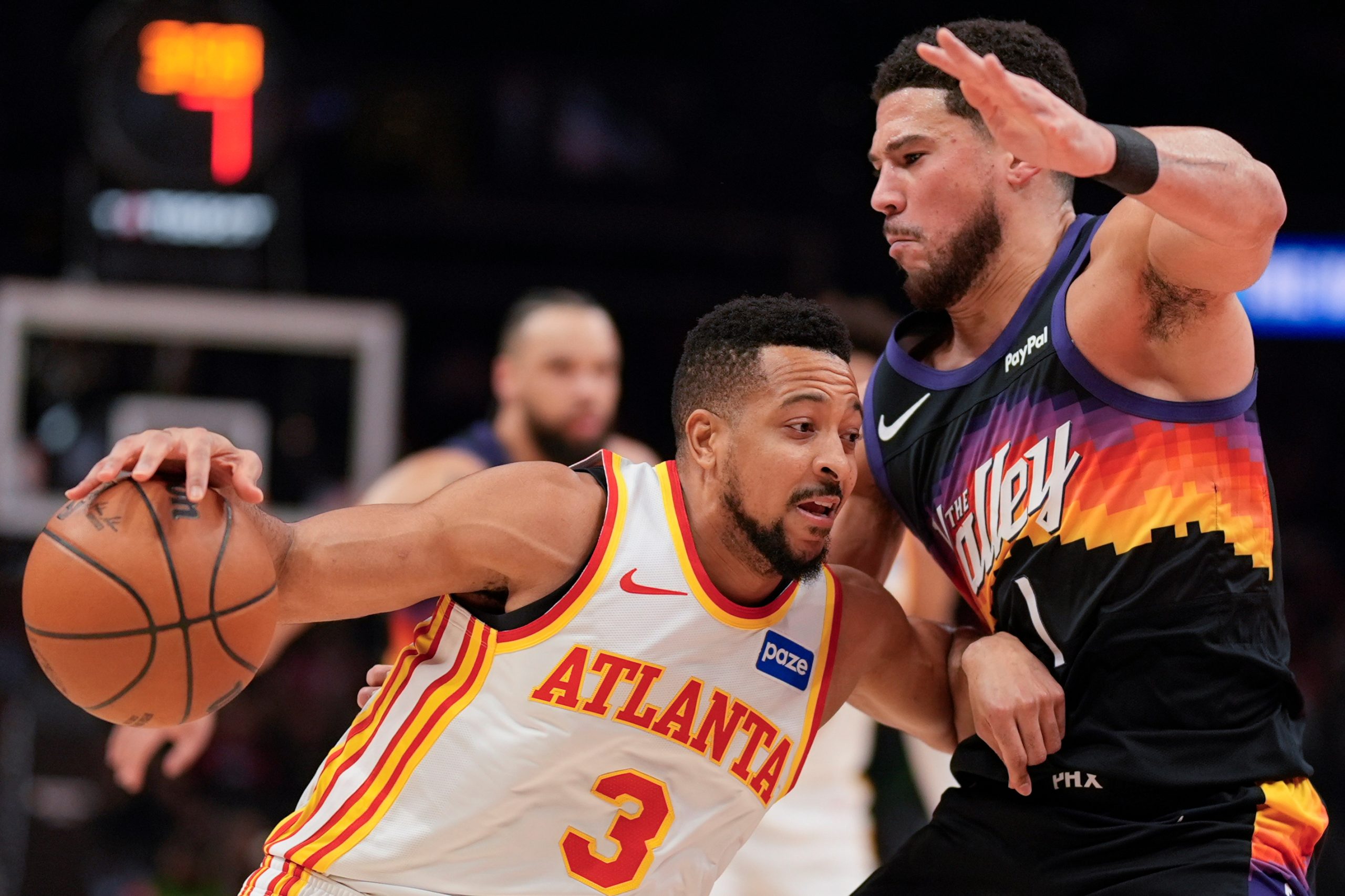 Suns’ Devin Booker exits with right ankle injury vs. Hawks